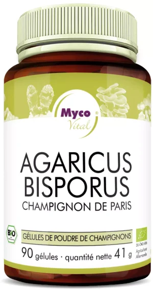 MycoVital_ Une bouteille marron et blanche étiquetée Agaricus Bisporus, indiquant qu'elle contient 90 capsules de poudre de champignons bio de MycoVital. L'étiquette comporte également des accents verts et une image de champignons.