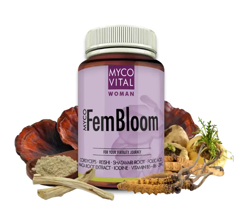 MycoVital_ A jar labeled MYCO VITAL WOMAN FemBloom stands among various dried mushrooms, roots, and herbs, suggesting a dietary supplement with natural ingredients.