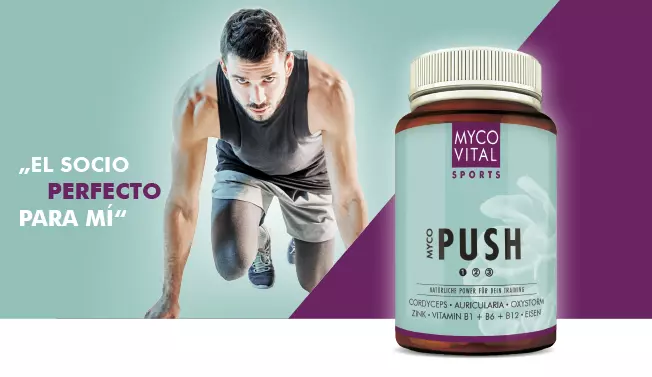 MycoVital_ Un hombre con ropa deportiva se agacha en posici&oacute;n de salida. A su lado hay un bote de suplementos MYCOVITAL SPORTS MYCO PUSH sobre un fondo morado y verde azulado con el texto en espa&ntilde;ol "El socio perfecto para m&iacute;".